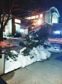 Snow covered street at night