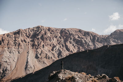 Scenic view of mountains against sky on sunny day