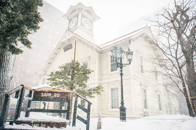 Low angle view of building against sky during winter