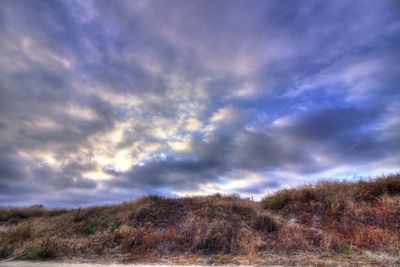 Scenic view of dramatic sky over land
