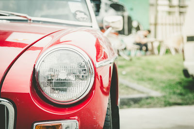 Close-up of red vintage car