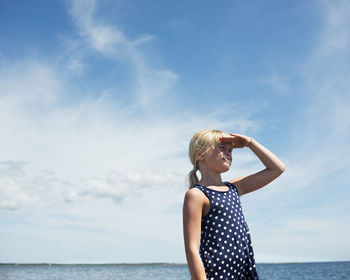 Girl gazing at ocean