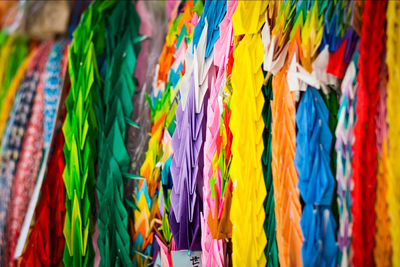 Colorful paper cranes arranged for sale