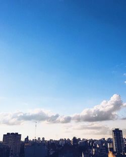 Cityscape against blue sky