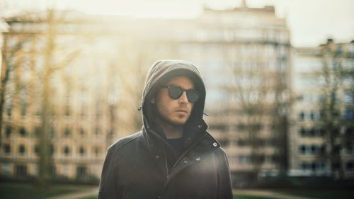 Portrait of young man standing outdoors