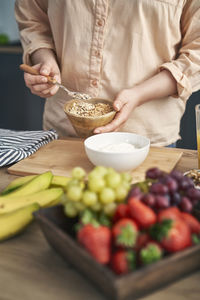 Midsection of woman preparing food