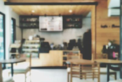 Empty chairs and tables in restaurant