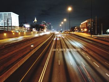 Light trails on road in city at night