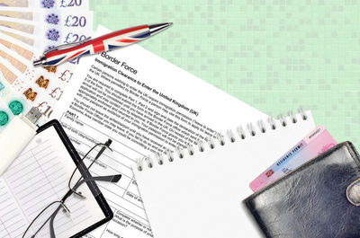 High angle view of pen and book on table