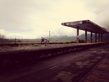 View of bridge against cloudy sky