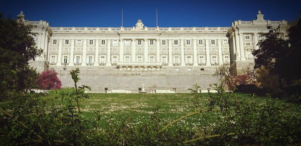 Facade of historic building against clear sky