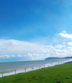 Scenic view of sea against cloudy sky