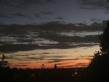 Scenic view of silhouette trees against sky at sunset