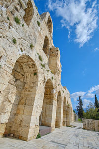 Low angle view of old ruins against sky