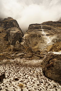 Rock formations on landscape against sky