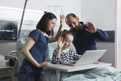 Young woman using laptop at home