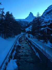 Scenic view of snow covered mountains