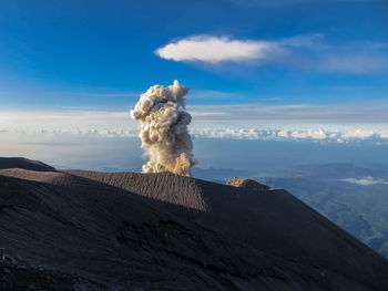 Rear view of female friends against sky