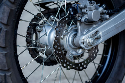 Close-up of rear wheel of motor cycle
