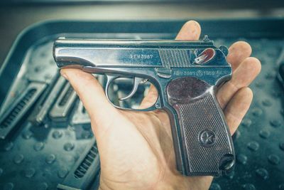 Close-up of person holding handgun