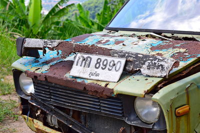 Close-up of abandoned car