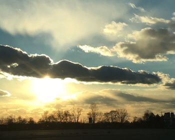 Scenic view of landscape against cloudy sky