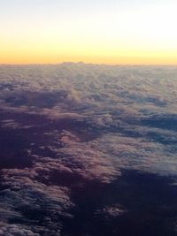 Scenic view of landscape against sky at sunset