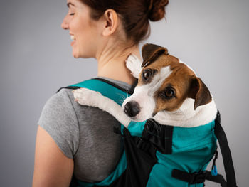 Portrait of young woman with dog