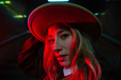 Close-up of young woman wearing hat