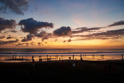 Scenic view of beach against sky during sunset