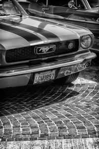 Close-up of vintage car on street