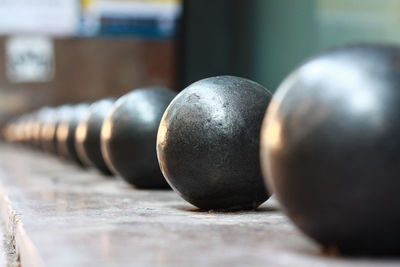 Close-up of steel balls in row on wall