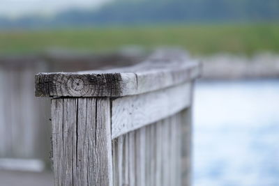 Close-up of wooden post on fence