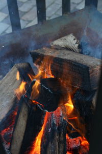 High angle view of fire on wood