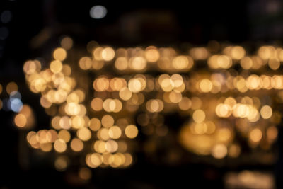 Defocused image of illuminated lights at night