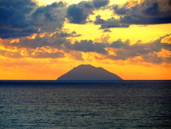 Scenic view of sea at sunset