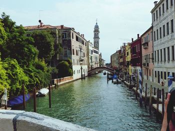 Canal passing through city buildings