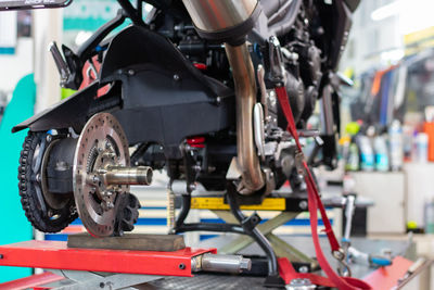 Close-up of work tools on workbench at workshop