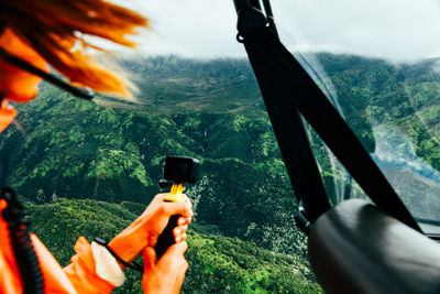 Female hair blowing in the wind in helicopter ride on kauai, hawaii.