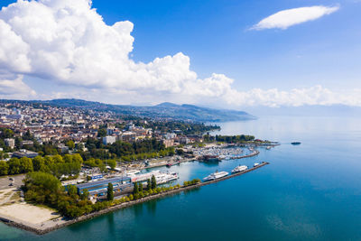 Panoramic view of sea and buildings against sky