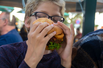 Close-up of a boy  eating food