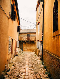 Narrow alley amidst buildings in town