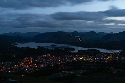 High angle view of illuminated buildings in city at night