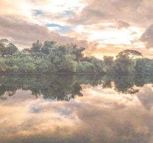 Scenic view of lake against sky during sunset