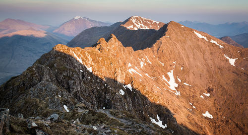 Close-up of mountain against sky during sunset