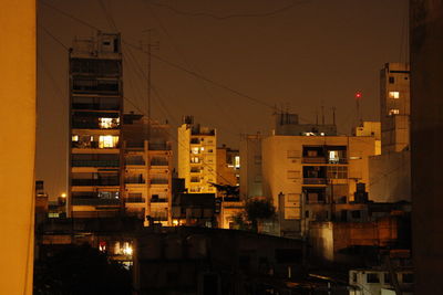 Buildings in city at night