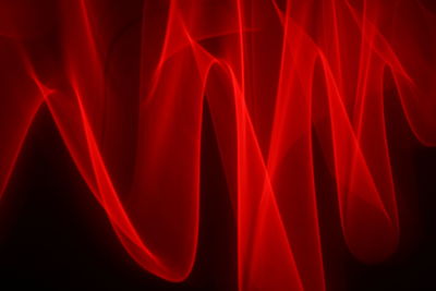 Close-up of light painting against black background