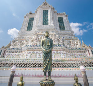 Low angle view of statue against building