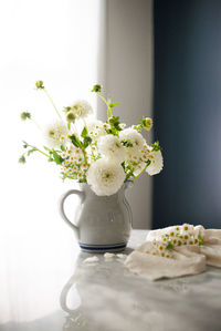 Close-up of flower vase on table