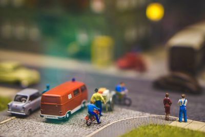 Figurines by toy cars